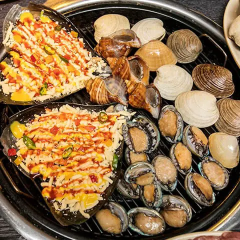 famous food in haeundae busan grilled clams and seafood