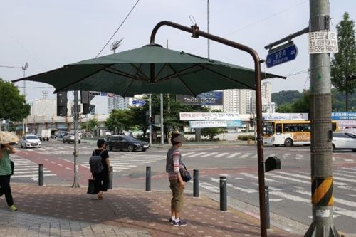 Sun parasols at crosswalks
