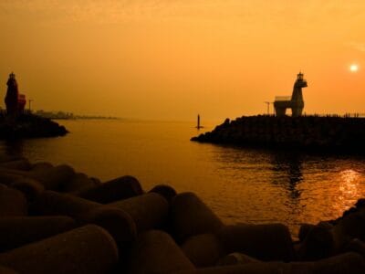 Catch Sunset Views at Iho Tewoo Beachu2019s Red & White Horse Lighthouses