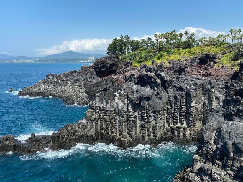 Admire Lava Pillars at Jungmun Daepo Jusangjeolli Cliff